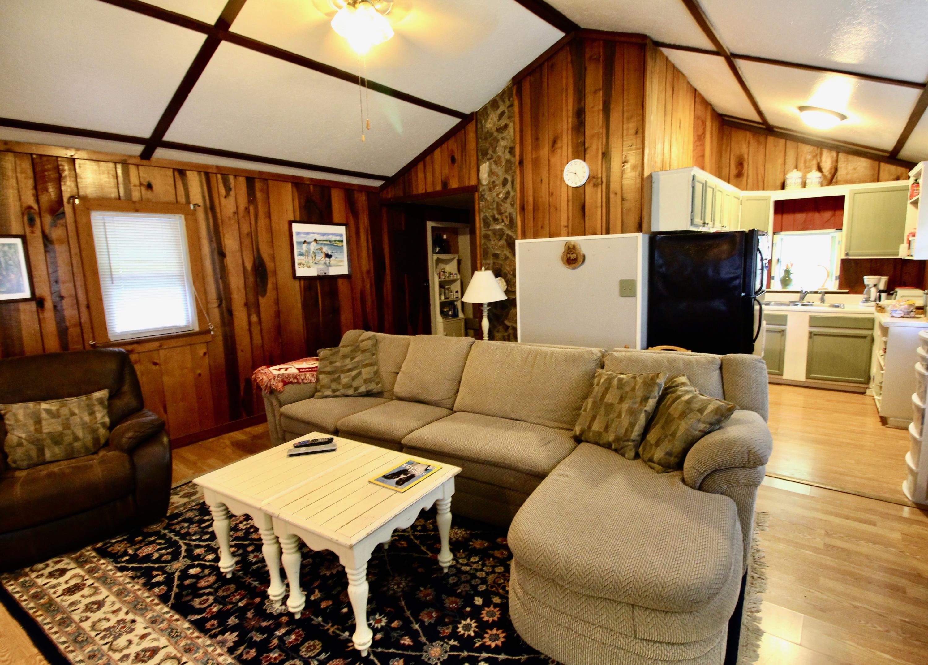 4066 Daugherty Road Salem, VA 24153 - Photo 12 of 23 a living room with furniture and a chandelier