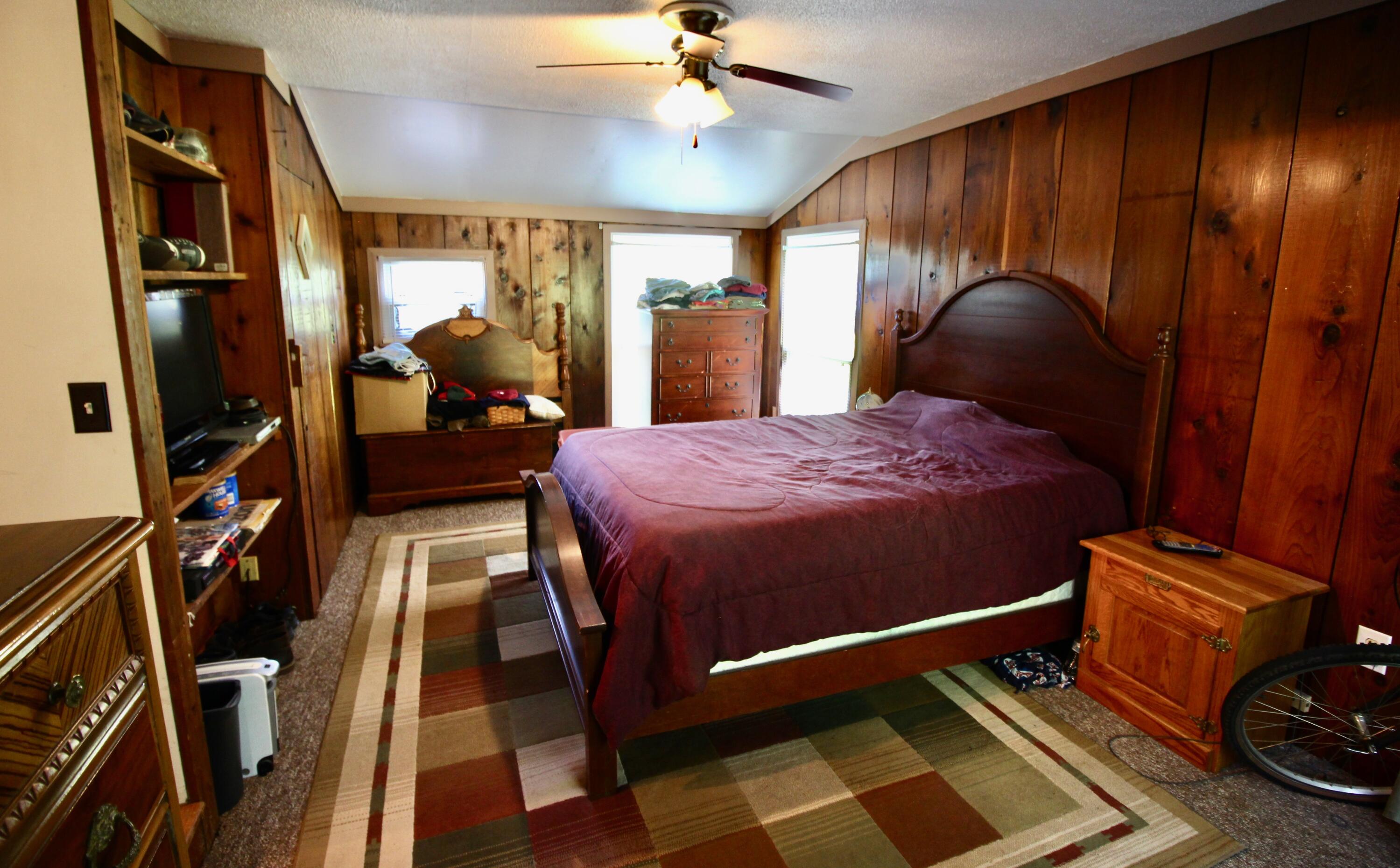 4066 Daugherty Road Salem, VA 24153 - Photo 17 of 23 a bedroom with a bed and a chandelier
