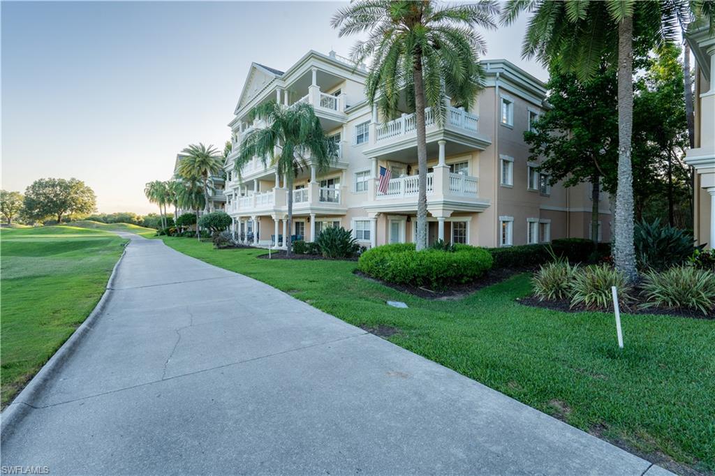1362 Centre Ct Ridge Drive, Unit 101 Reunion, FL 34747 - Photo 23 of 25 View of outdoor building at dusk