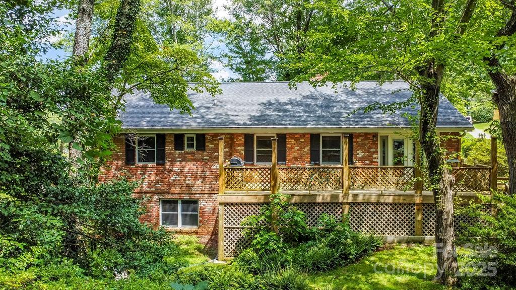3 Stockwood Road Asheville, NC 28803 - Photo 13 of 36 a front view of a house with a garden