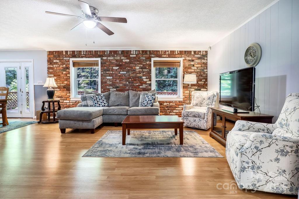 3 Stockwood Road Asheville, NC 28803 - Photo 2 of 36 a living room with furniture and a flat screen tv