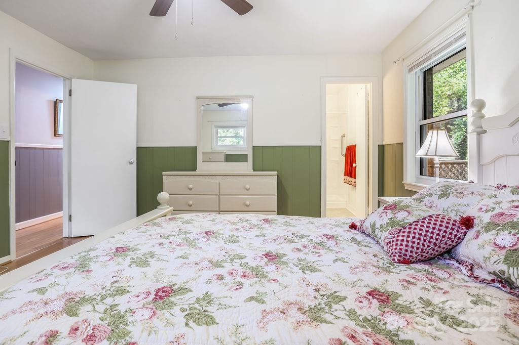 3 Stockwood Road Asheville, NC 28803 - Photo 26 of 36 a bedroom with a large bed and a dresser