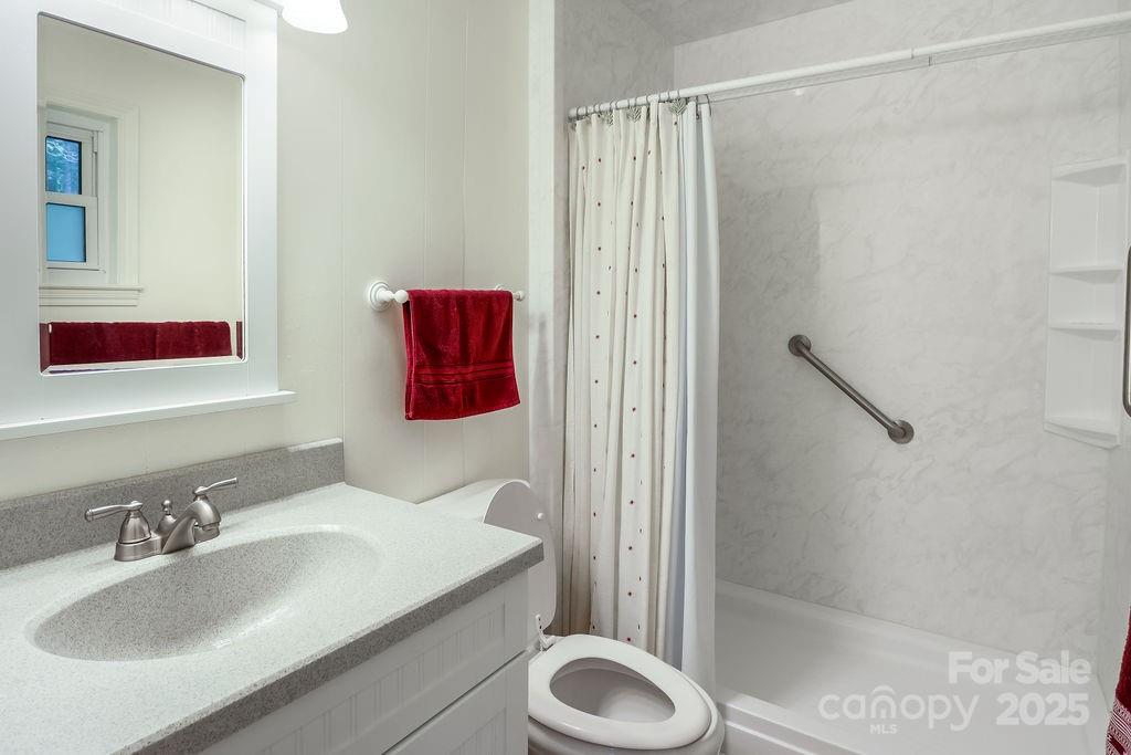 3 Stockwood Road Asheville, NC 28803 - Photo 27 of 36 a bathroom with a sink toilet and shower