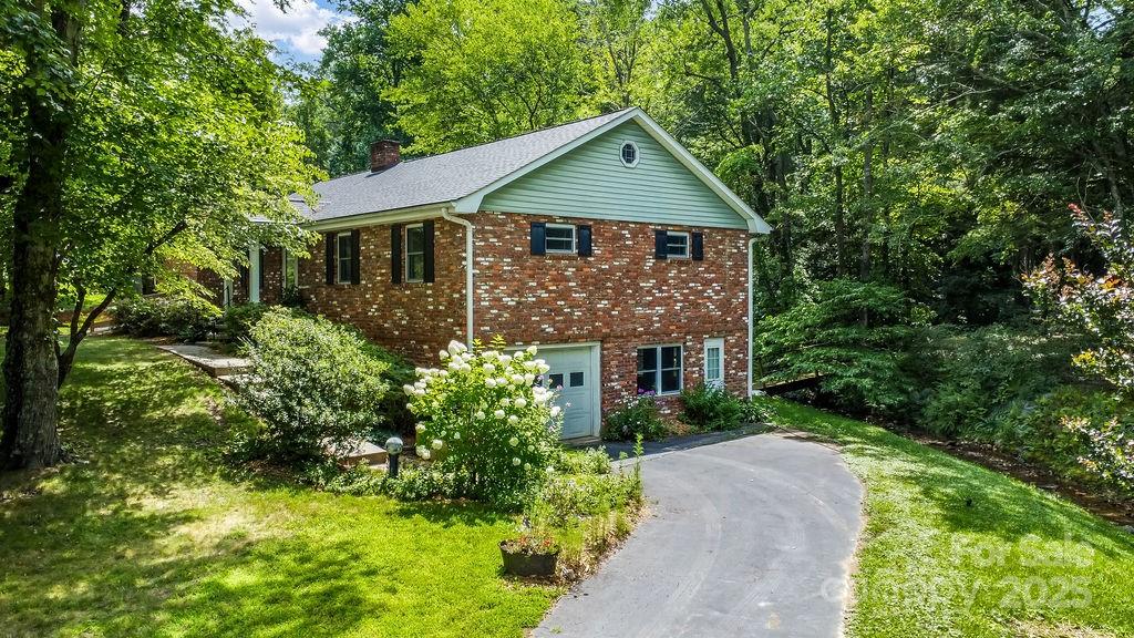3 Stockwood Road Asheville, NC 28803 - Photo 31 of 36 a front view of house with yard and green space