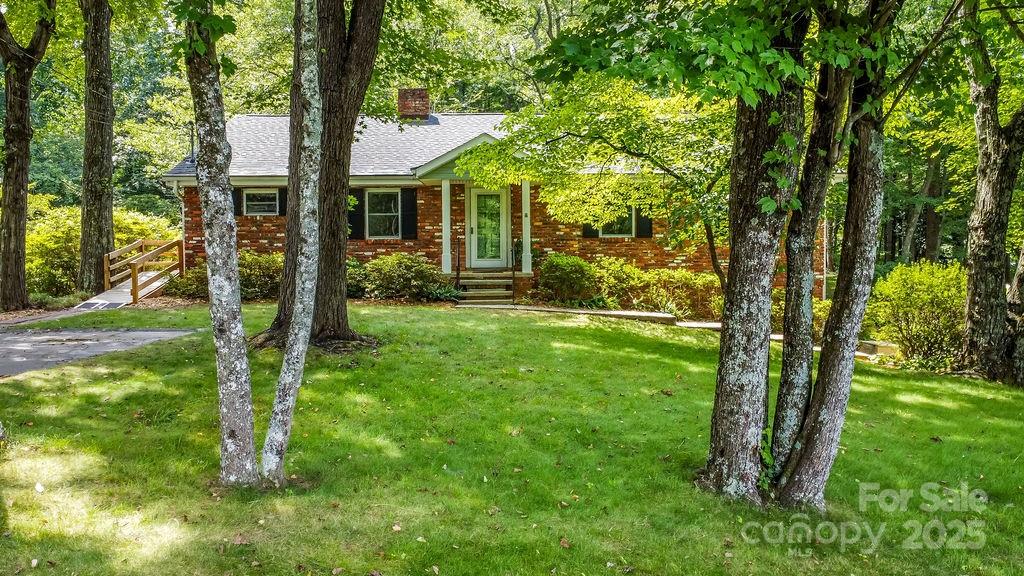 3 Stockwood Road Asheville, NC 28803 - Photo 34 of 36 a view of a house with backyard