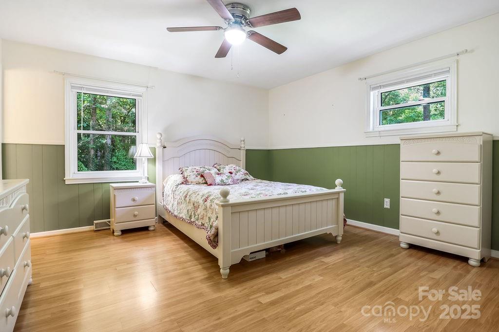 3 Stockwood Road Asheville, NC 28803 - Photo 4 of 36 a bedroom with a bed and a window