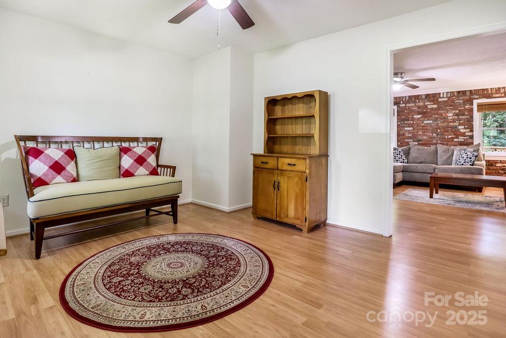 3 Stockwood Road Asheville, NC 28803 - Photo 7 of 36 a living room with furniture and a wooden floor