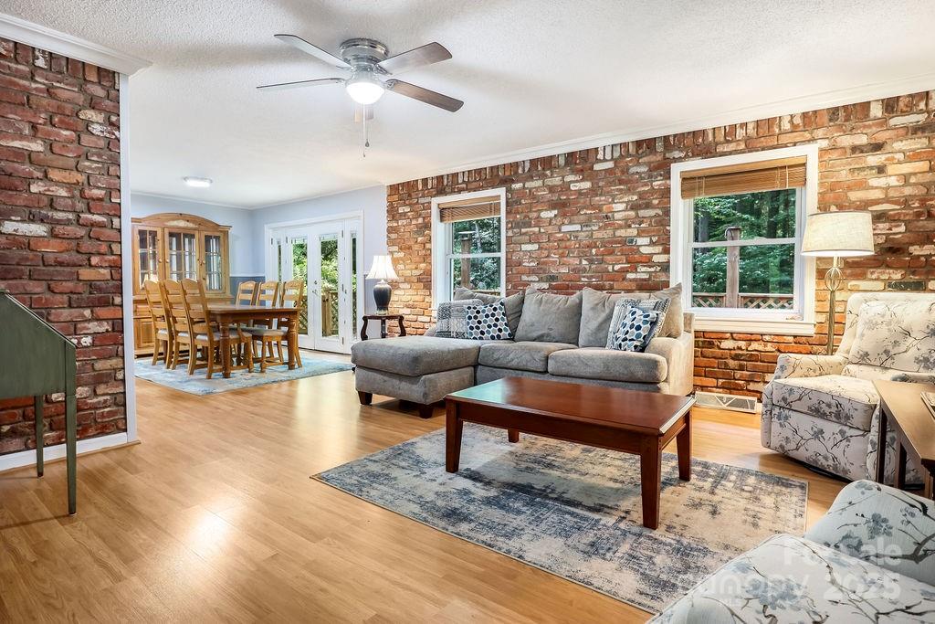 3 Stockwood Road Asheville, NC 28803 - Photo 8 of 36 a living room with furniture and a large window