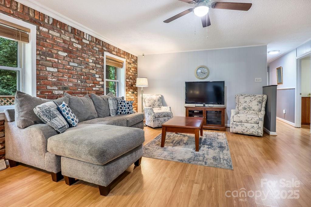 3 Stockwood Road Asheville, NC 28803 - Photo 9 of 36 a living room with furniture and a flat screen tv