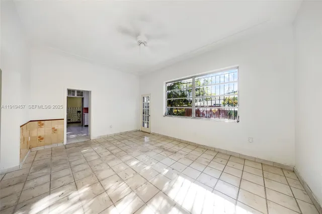 a kitchen with stainless steel appliances a refrigerator sink and microwave