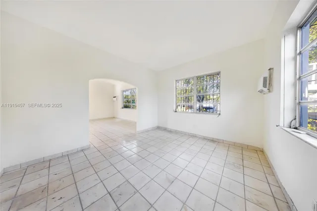 a bathroom with a toilet a sink and a mirror