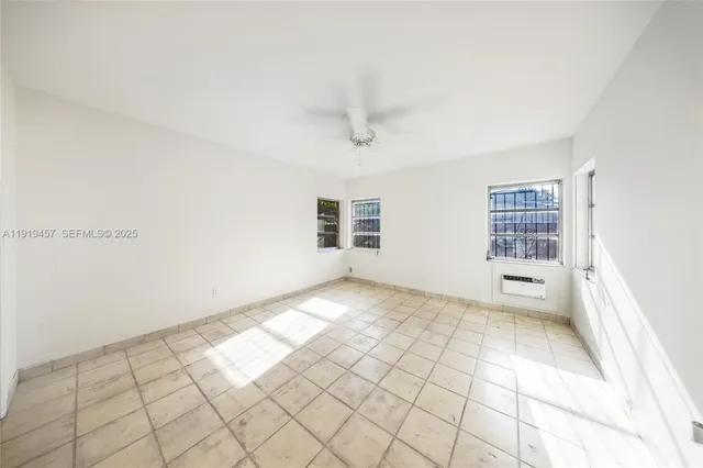 a view of an empty room and window