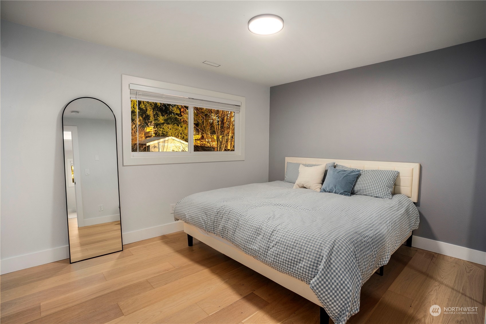 24301 7th Place West Bothell, WA 98021 - Photo 16 of 38 a bedroom with a bed and a painting on the wall