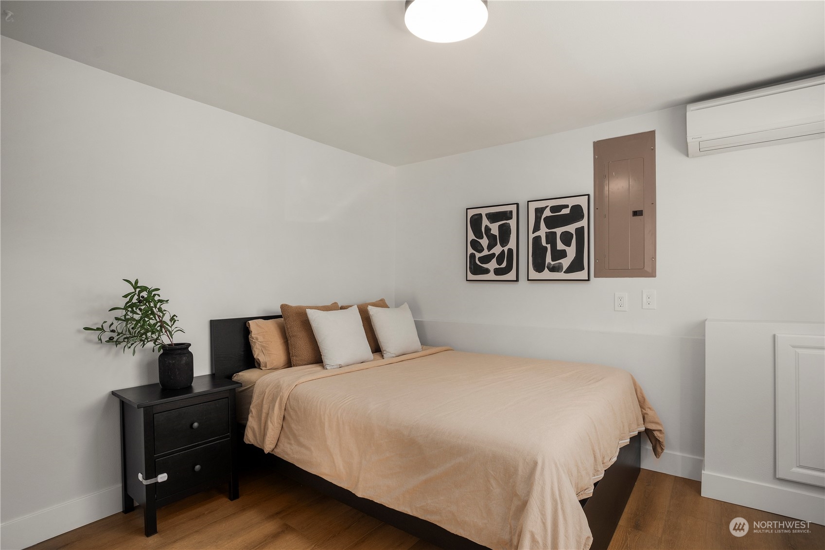 24301 7th Place West Bothell, WA 98021 - Photo 29 of 38 a bedroom with a large bed and a potted plant