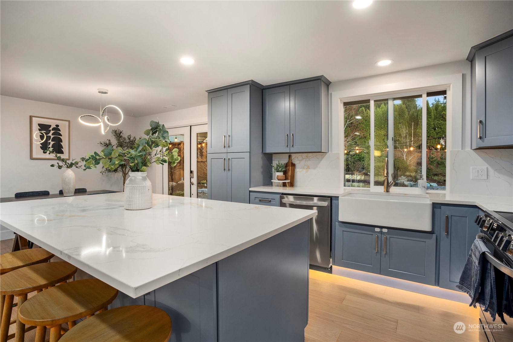 24301 7th Place West Bothell, WA 98021 - Photo 9 of 38 a kitchen with kitchen island a stove and a table