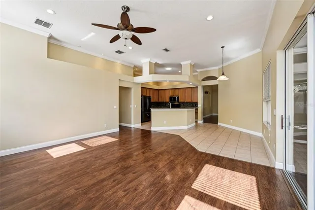 a view of kitchen and wooden floor