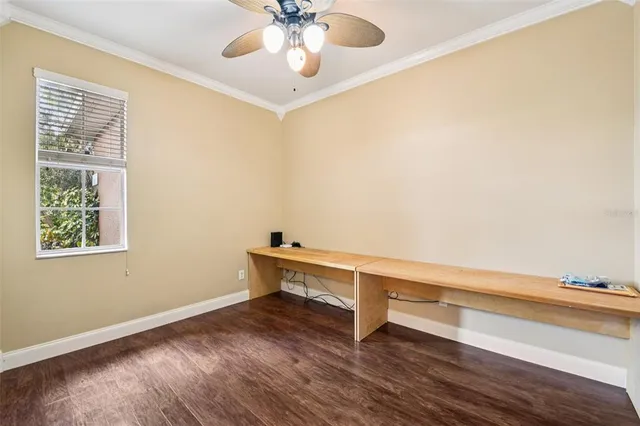a view of room with window and wooden floor