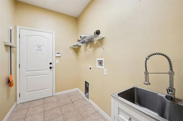 a bathroom with a sink and washing machine