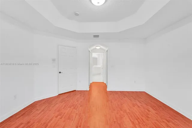 a view of a big room with closet and wooden floor