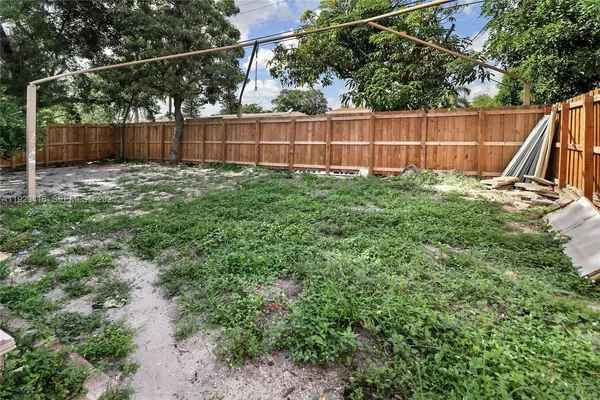 a view of a backyard with a small cabin