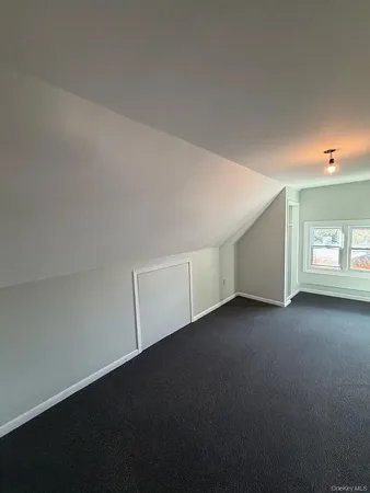 a view of an empty room with a garage