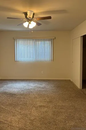 a view of an empty room with windows