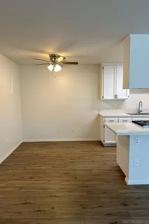 a bathroom with a sink vanity mirror and toilet