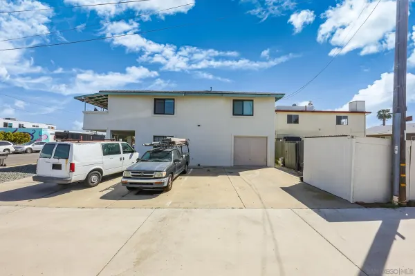 a view of car parked in front of house