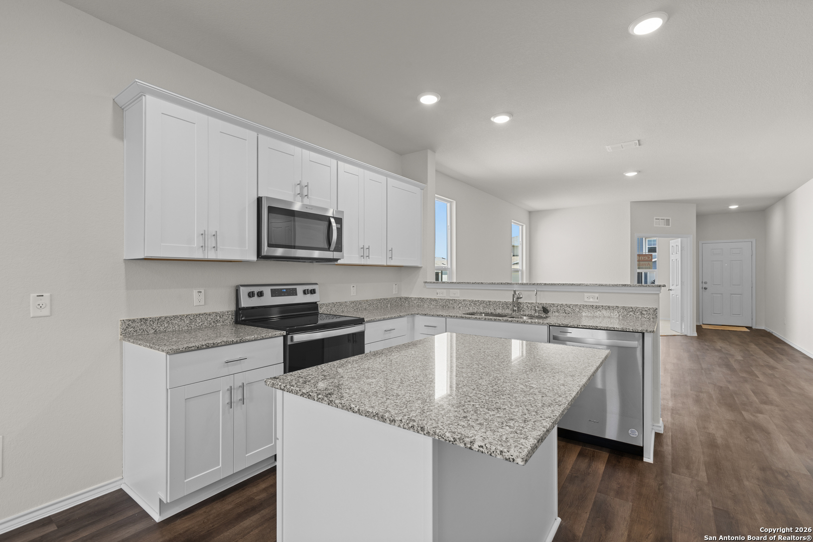 4137 Bermuda Lane Seguin, TX 78155 - Photo 15 of 24 a kitchen with granite countertop a sink stove and microwave