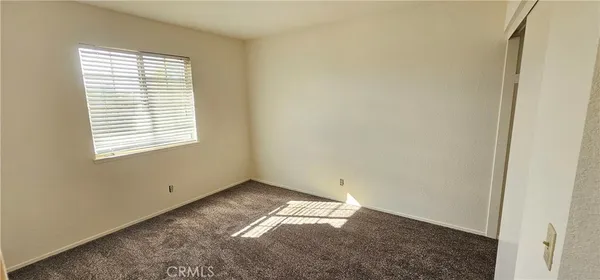 a kitchen with a stove and a refrigerator