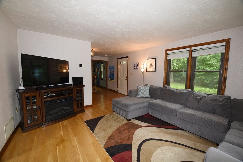 204 Marion Road Middleboro, MA 02346 - Photo 20 of 40 a living room with furniture and a flat screen tv
