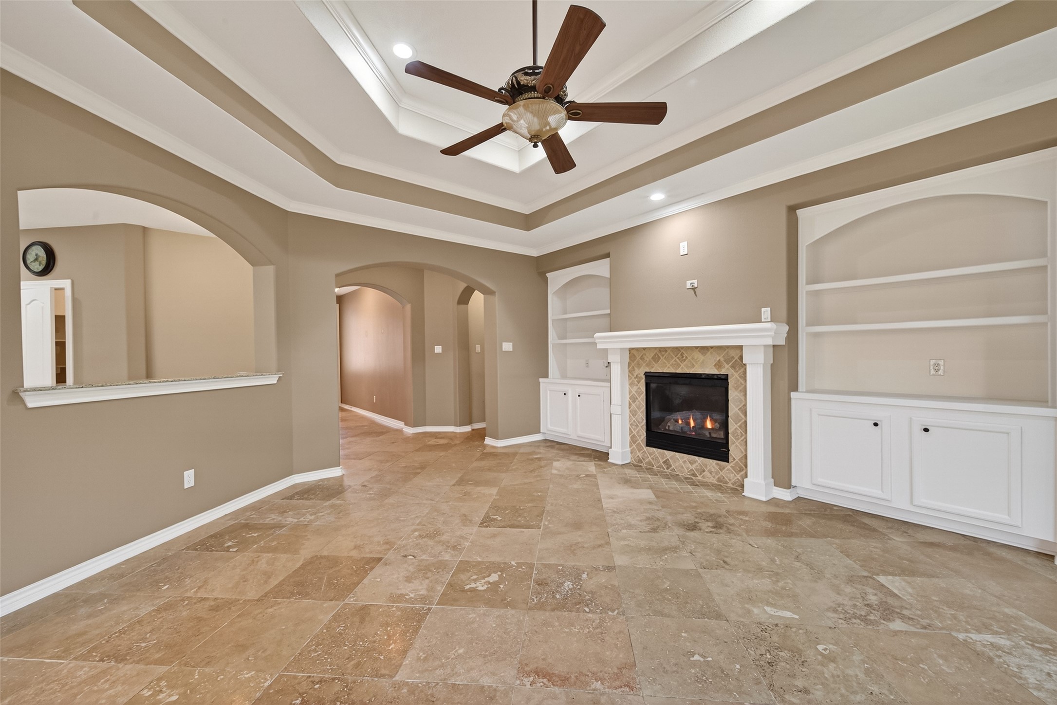 15 Wick Willow Road Montgomery, TX 77356 - Photo 11 of 49 a view of a livingroom with a fireplace and a ceiling fan