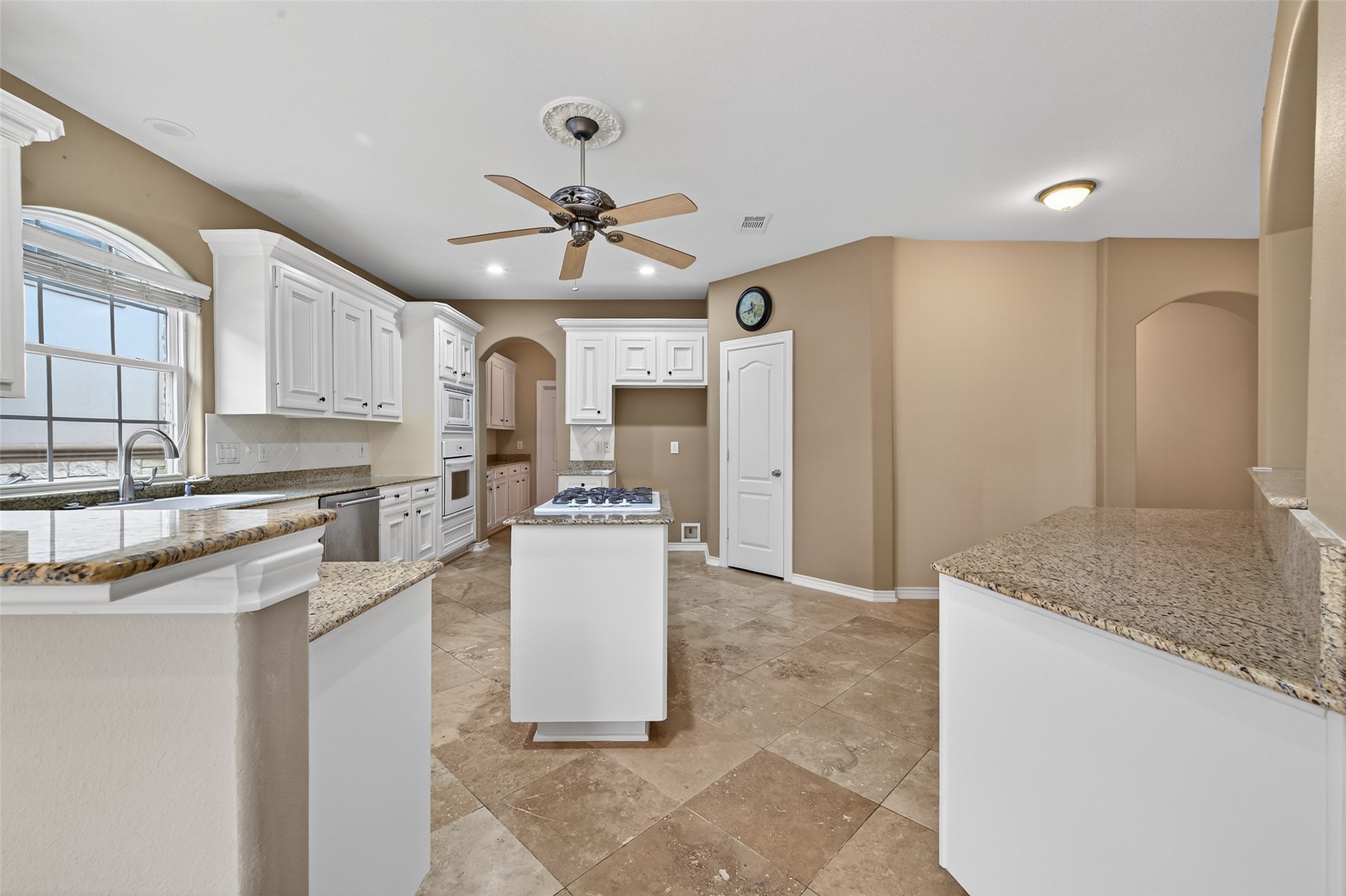 15 Wick Willow Road Montgomery, TX 77356 - Photo 16 of 49 a kitchen with stainless steel appliances granite countertop a sink a stove a refrigerator cabinets and living room view