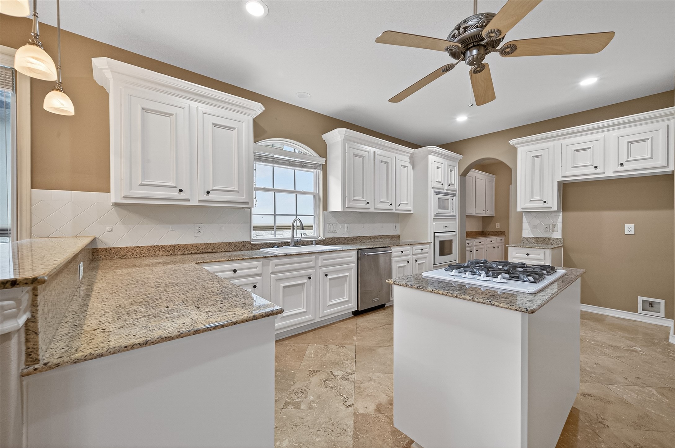 15 Wick Willow Road Montgomery, TX 77356 - Photo 17 of 49 a kitchen with granite countertop a sink stove and cabinets