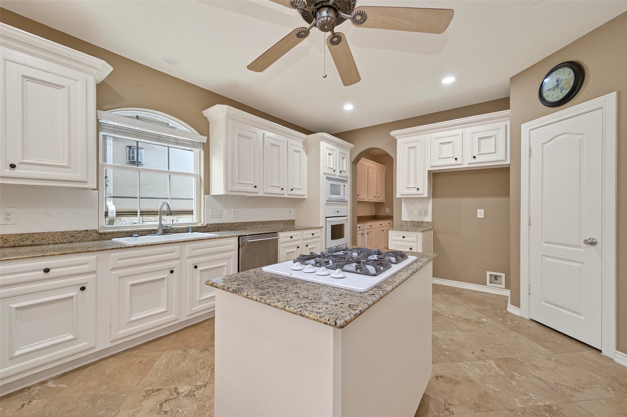 15 Wick Willow Road Montgomery, TX 77356 - Photo 18 of 49 a kitchen with granite countertop cabinets a sink a stove and a refrigerator