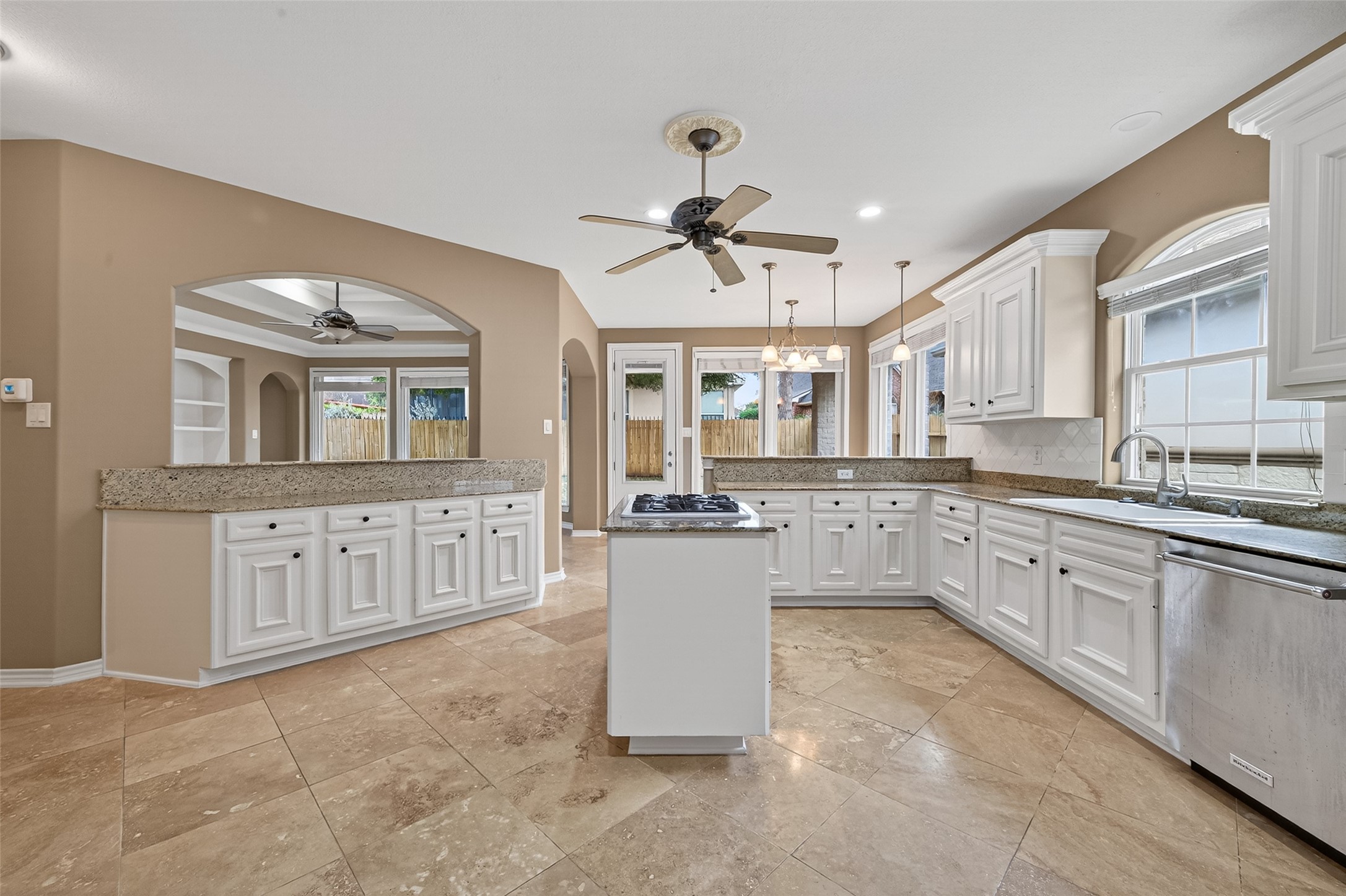 15 Wick Willow Road Montgomery, TX 77356 - Photo 21 of 49 a kitchen with kitchen island granite countertop a sink and cabinets