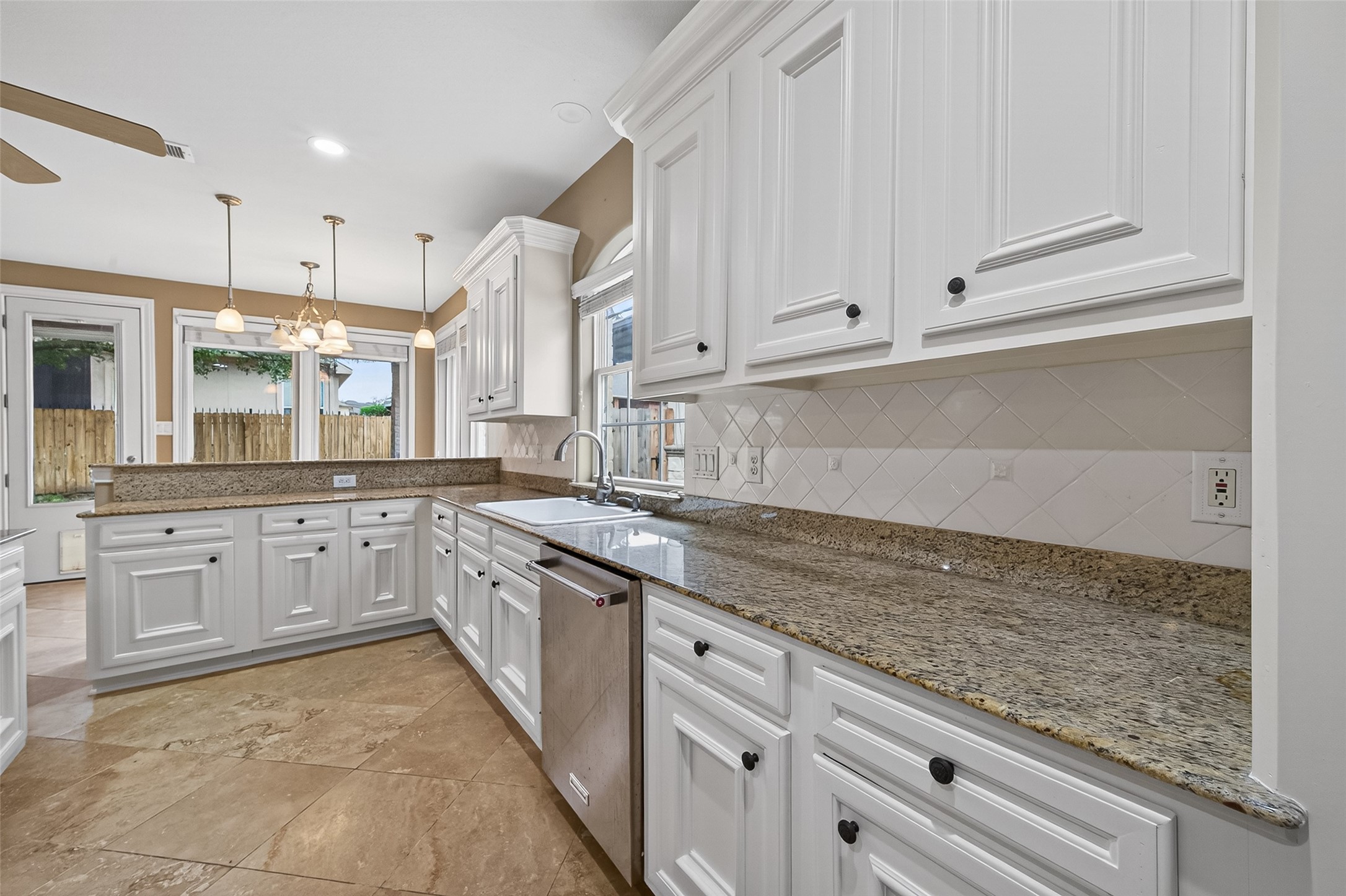 15 Wick Willow Road Montgomery, TX 77356 - Photo 22 of 49 a kitchen with granite countertop white cabinets and white stainless steel appliances