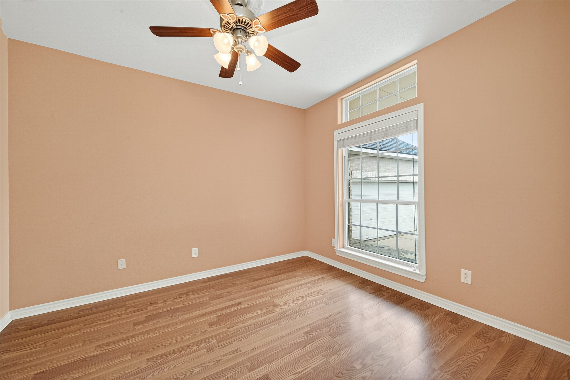 15 Wick Willow Road Montgomery, TX 77356 - Photo 34 of 49 an empty room with wooden floor fan and windows