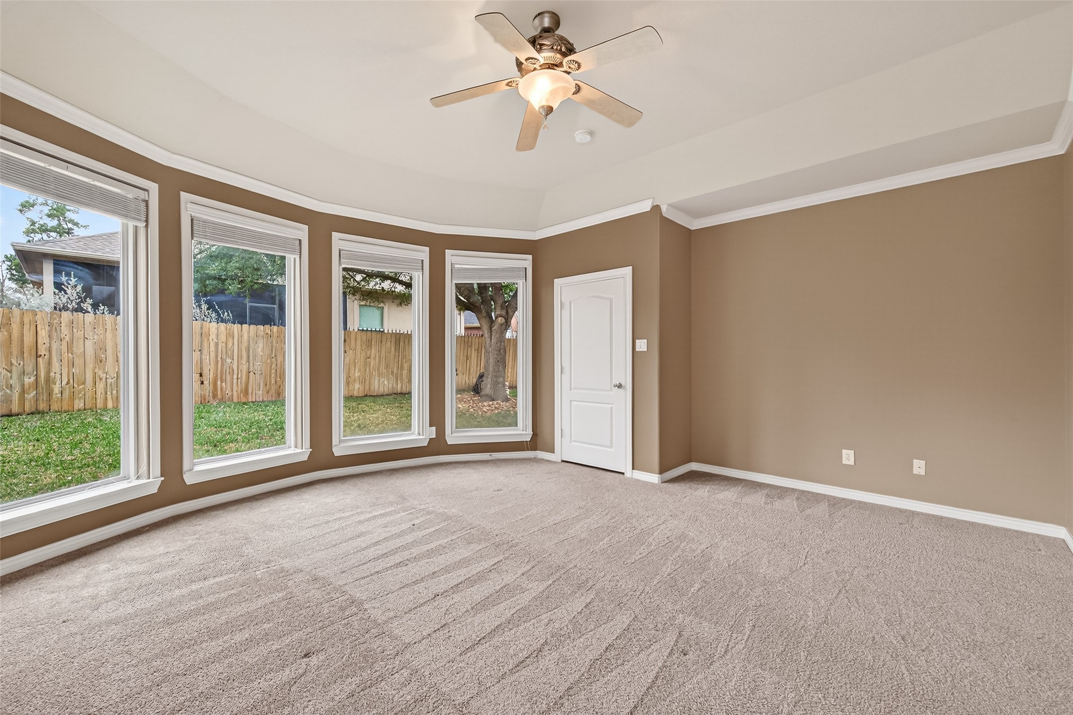 15 Wick Willow Road Montgomery, TX 77356 - Photo 39 of 49 a view of an empty room with a window and a kitchen