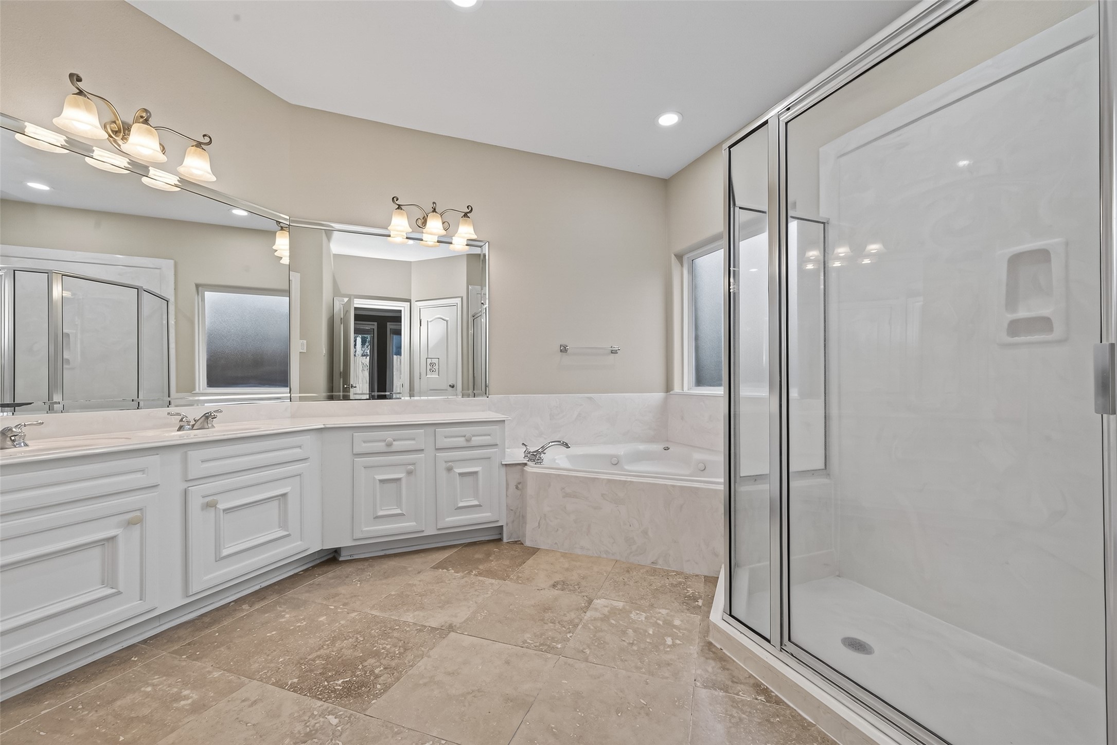 15 Wick Willow Road Montgomery, TX 77356 - Photo 43 of 49 a spacious bathroom with a granite countertop sink mirror and a bathtub