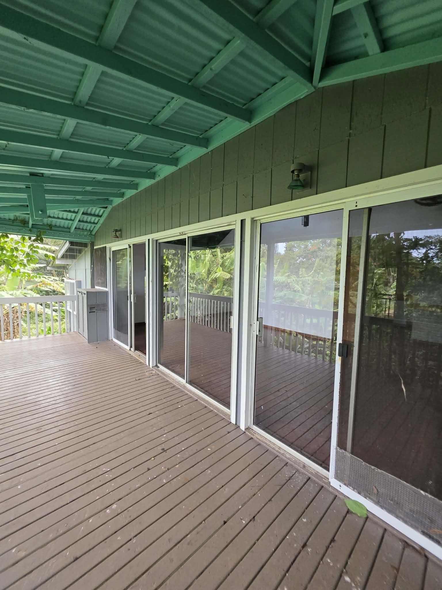 420 Haumana Road Haiku, HI 96708 - Photo 20 of 31 a view of an empty room with wooden floor and a window