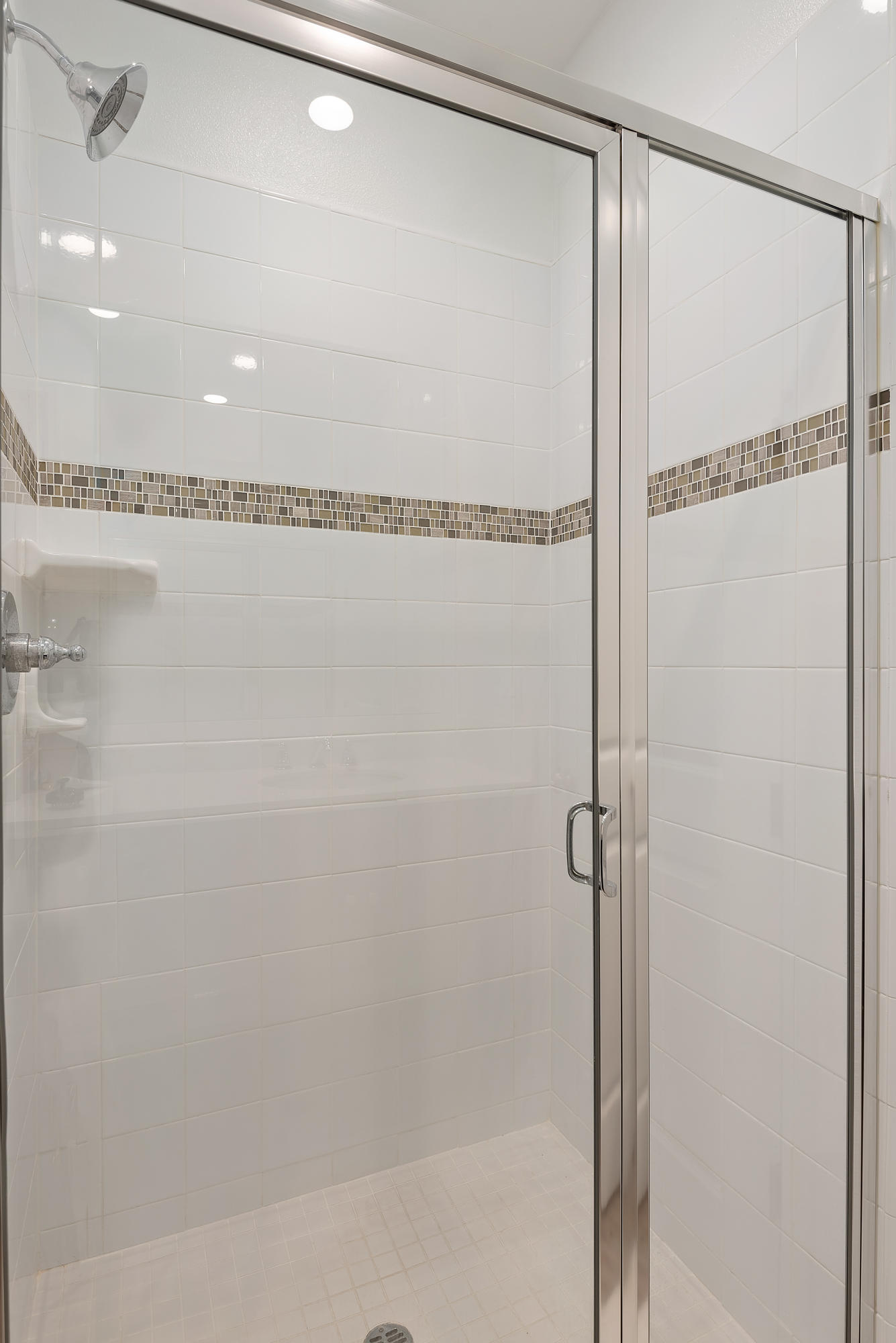 242 Robles Way Buellton, CA 93427 - Photo 13 of 25 a bathroom with a glass shower door