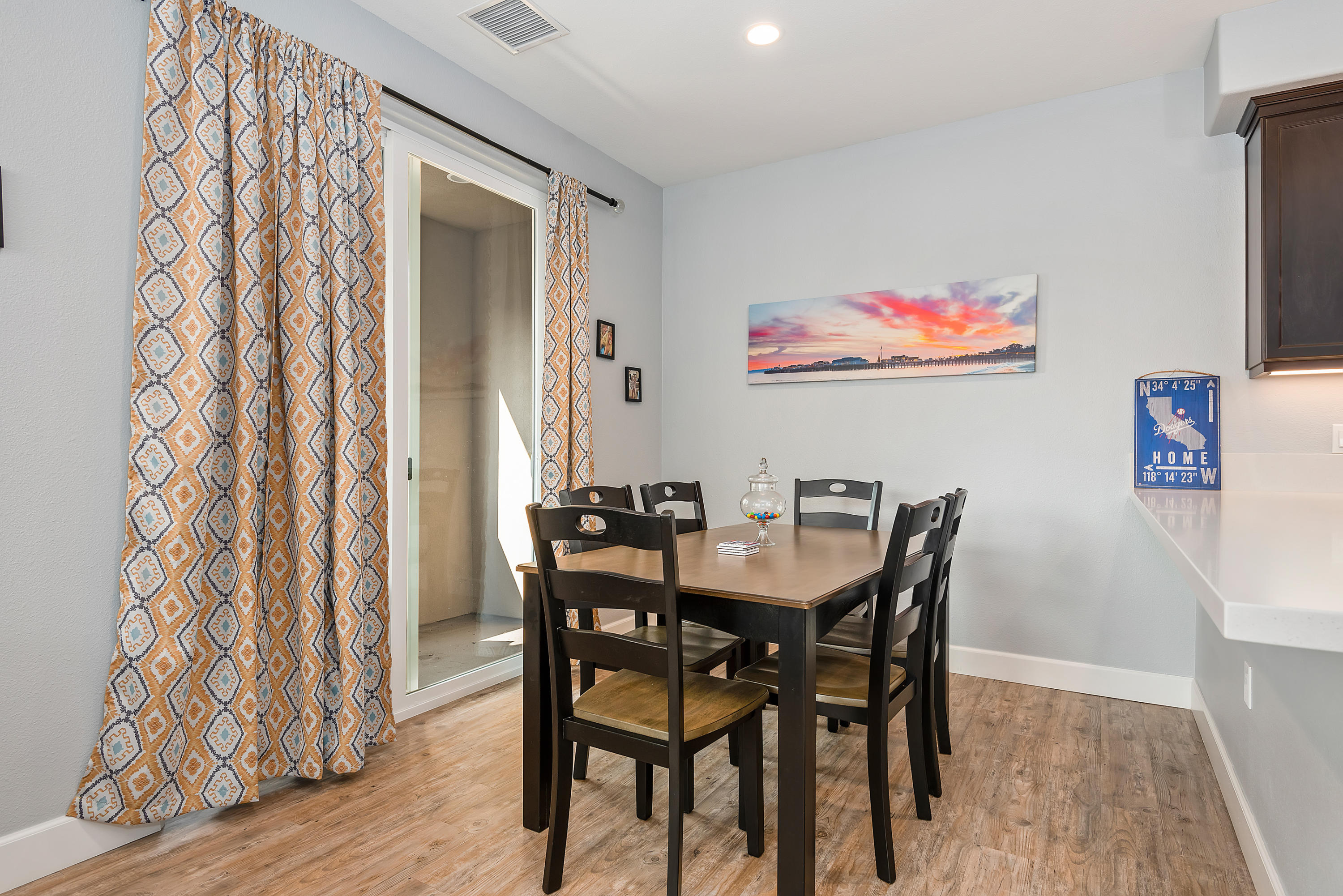242 Robles Way Buellton, CA 93427 - Photo 6 of 25 a view of a dining room with furniture and wooden floor