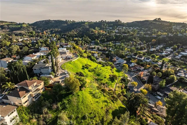 a view of a city with mountains in the background