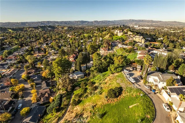an aerial view of residential building with parking space