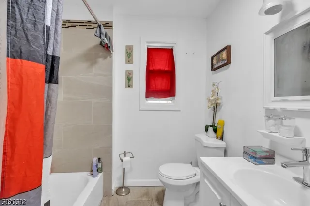 a bathroom with a sink toilet and bathtub