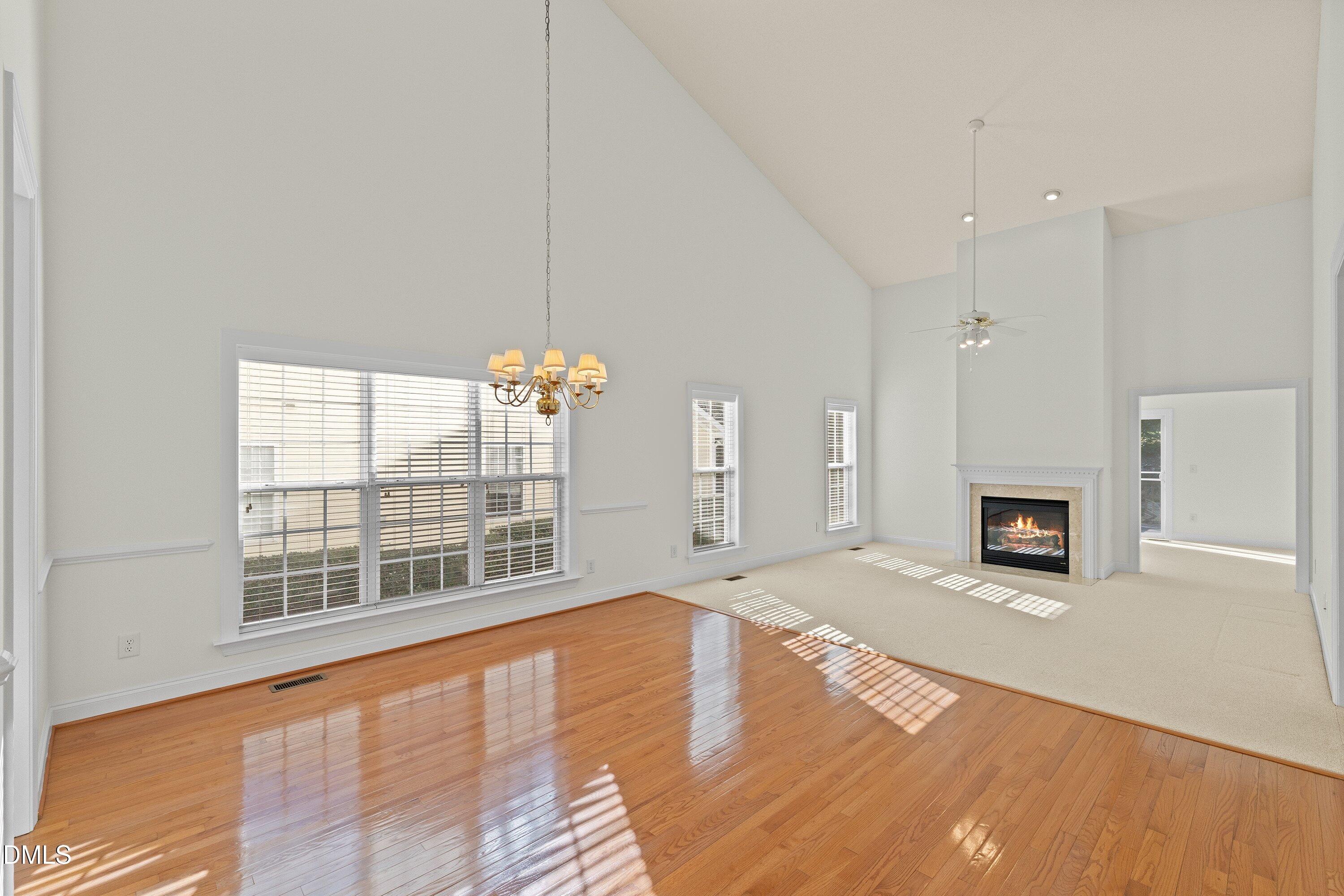105 Rockport Ridge Way Cary, NC 27519 - Photo 14 of 43 a view of a livingroom with wooden floor and a fireplace