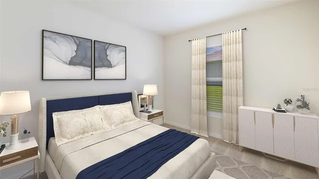 a bedroom with a bed and a lamp