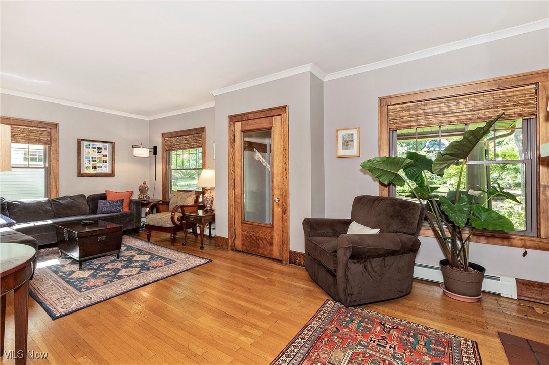 2985 Coleridge Road Cleveland, OH 44118 - Photo 12 of 46 Living area featuring light wood finished floors, ornamental molding, and plenty of natural light