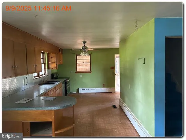 a view of a livingroom with furniture and windows
